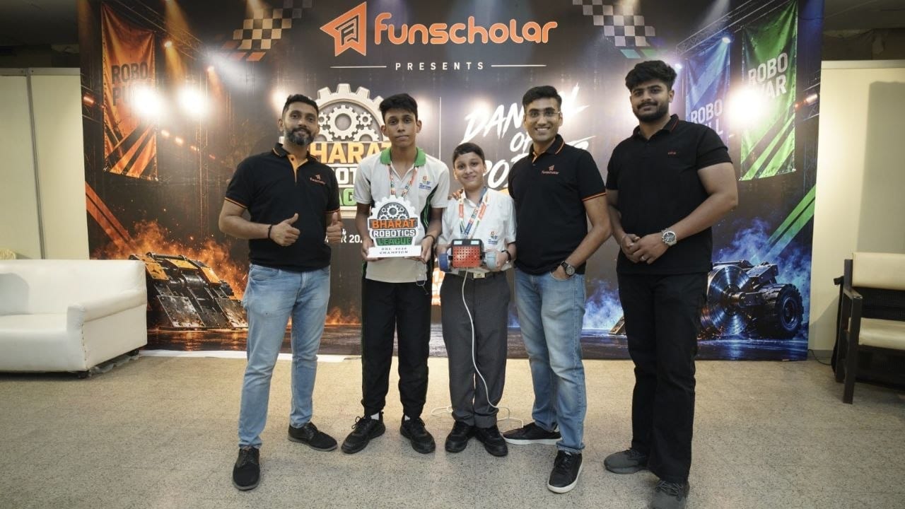 A winning team receiving their trophy from the organisers