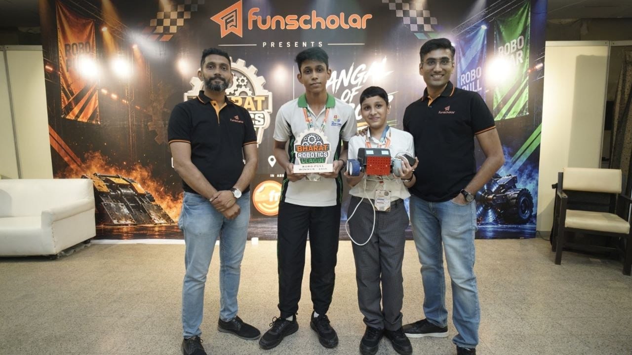A winning team receiving their trophy from the organisers